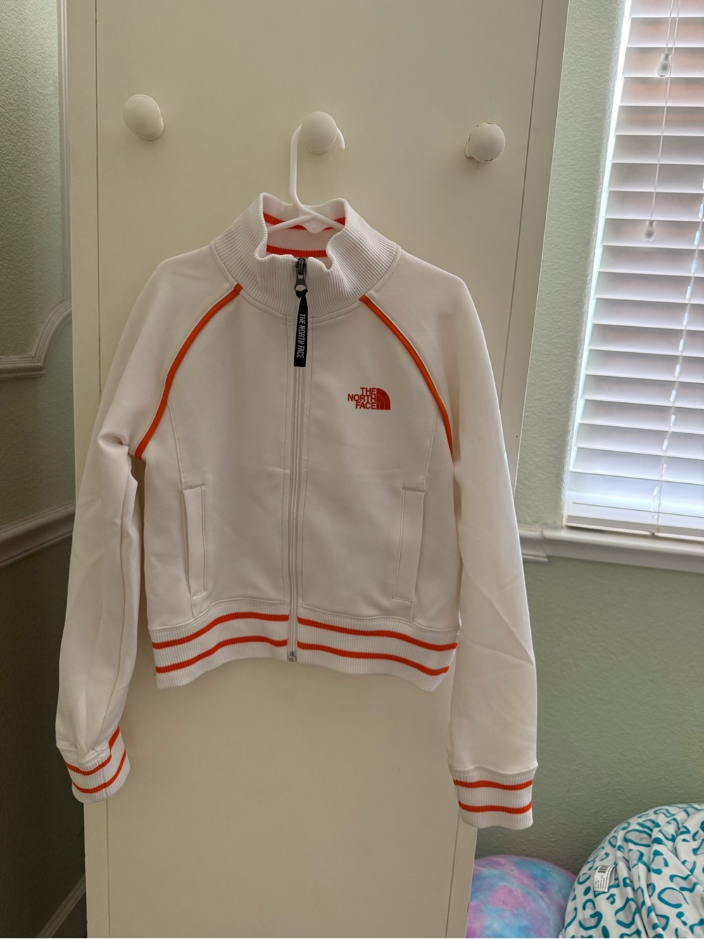 The North Face White Jacket with Orange Accents